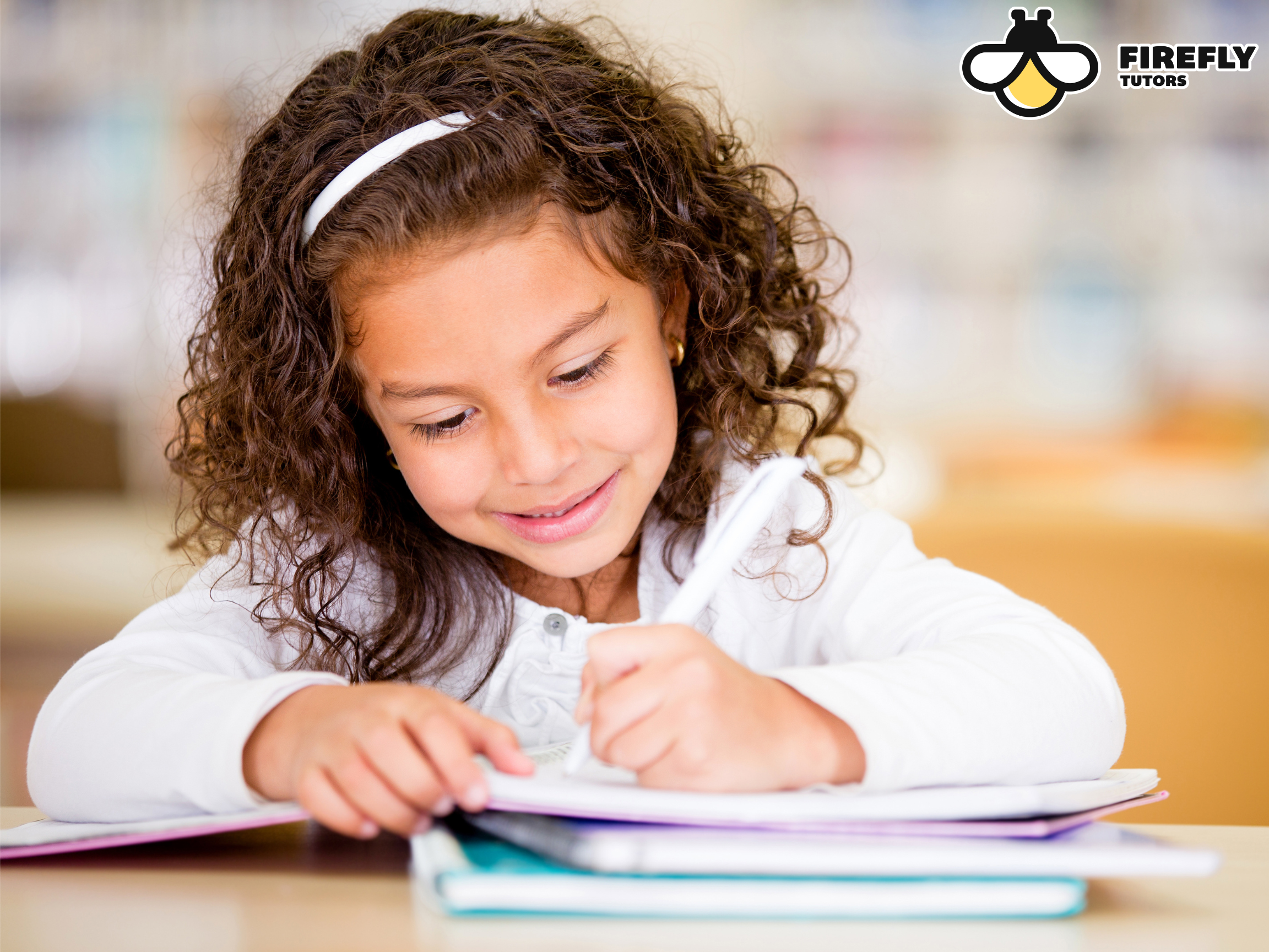 Elementary-age homeschool student practicing writing skills as part of her California homeschool curriculum