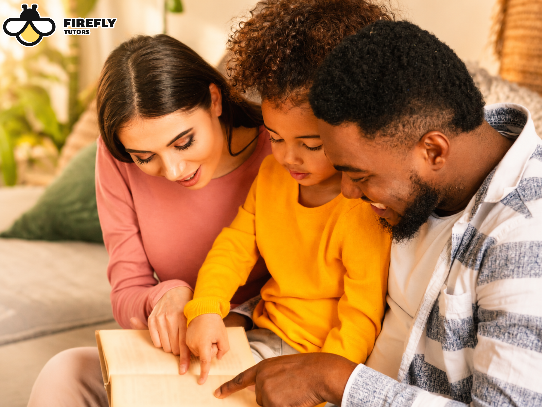 Parents reading a book with their child at home to prevent summer learning loss